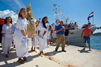 Young pilgrims carrying the Snow Madonna statue, Kukljica, island Ugljan, Croatia