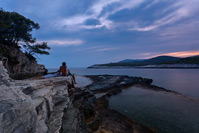 Young couple on Srebrena beach at sunset, island Vis, Dalmatia, Croatia