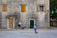 Children playing on the street in Stari Grad, island Hvar, Croatia