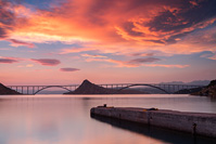 Sunset above island Krk bridge and town Rijeka, Kvarner, Croatia